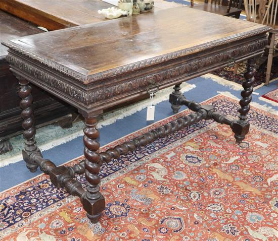 A Flemish style carved oak two drawer serving table W.130cm